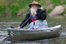 Dan Cooke, owner of Cooke Custom Sewing, paddles his Phoenix canoe with a custom spray skirt he made. He was participating in the Northstar Experience