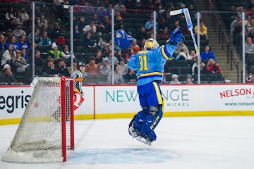 St. Cloud Cathedral's Nick Hansen celebrates a 3-1 victory against Hermantown in the Class 1A title game at Xcel Energy Center in St. Paul on Saturday