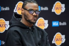 Former USC guard Bronny James takes questions from the media as he's introduced as a Los Angeles Lakers draft pick at a news conference in El Segundo,