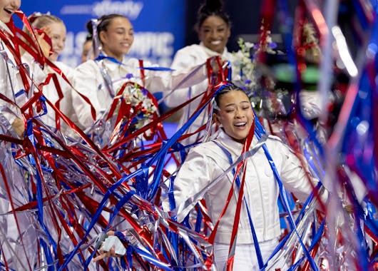 St. Paul's Suni Lee celebrates with teammates after being introduced as a member of the U.S. Olympic team on Sunday after the U.S. gymnastics Olympic 