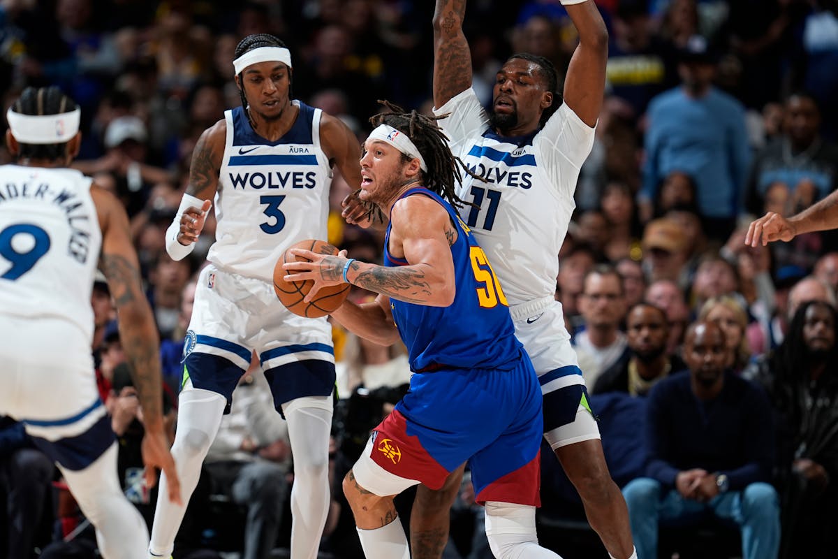 Jaden McDaniels (3) and Naz Reid guard Aaron Gordon during Game 1 of the Western Conference semifinals.