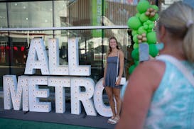 Champlin Park volleyball player Carly Gilk posed for a photo by her mom, Shelley, when they arrived for the AMSA celebration at Target Field.