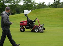 Josh Kravik, Toro’s global product marketing manager, demonstrates the capability of Toro’s autonomous fairway mower at Interlachen Country Club.