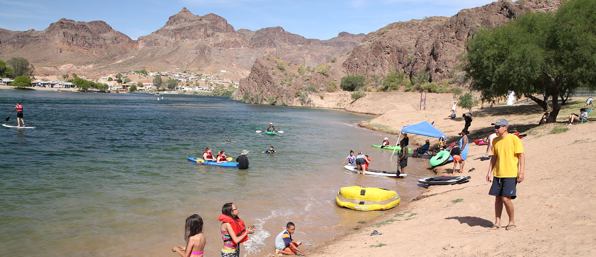 A family swimming in the Colorado River at River Island State Park