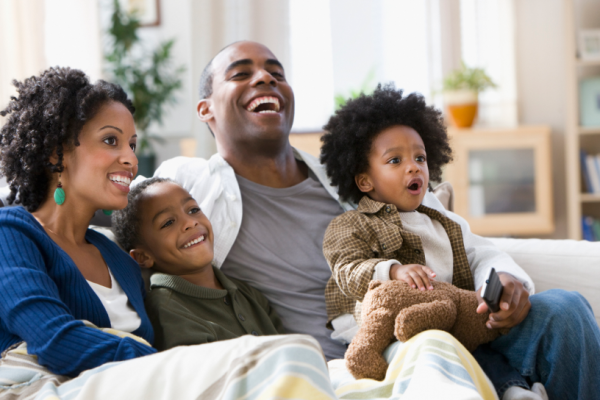 Parents and children relaxing at home