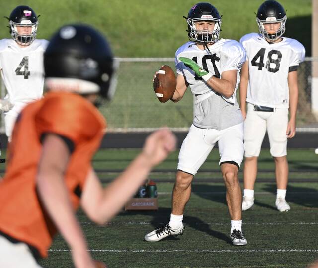 Latrobe quarterback John Wetzel looks to throw on the first day of preseason practice.