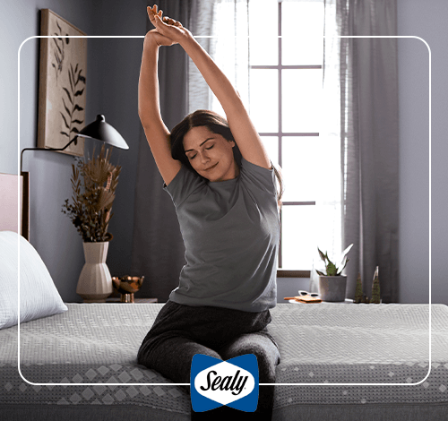 Woman stretching on a Sealy mattress