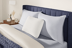 Symphony pillow on a styled bed