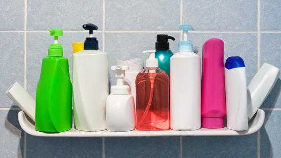 Various bath products displayed on shelf in shower