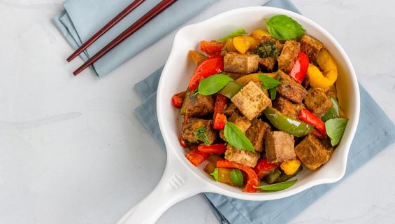 Tofu and vegetables in enamel serving skillet