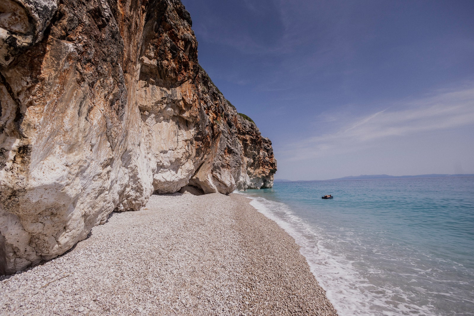 Image may contain Rock Beach Coast Nature Outdoors Sea Shoreline Water Cliff Scenery Landscape and Sky