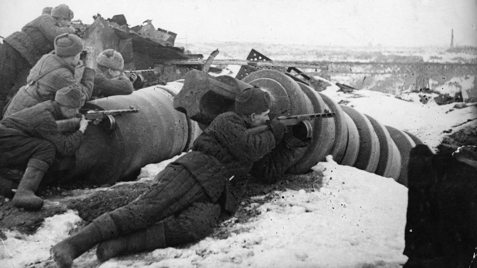 Armed with light machine guns, Soviet troops attack the German forces in the vicinity of the Red October plant in Stalingrad on November 26, 1942.