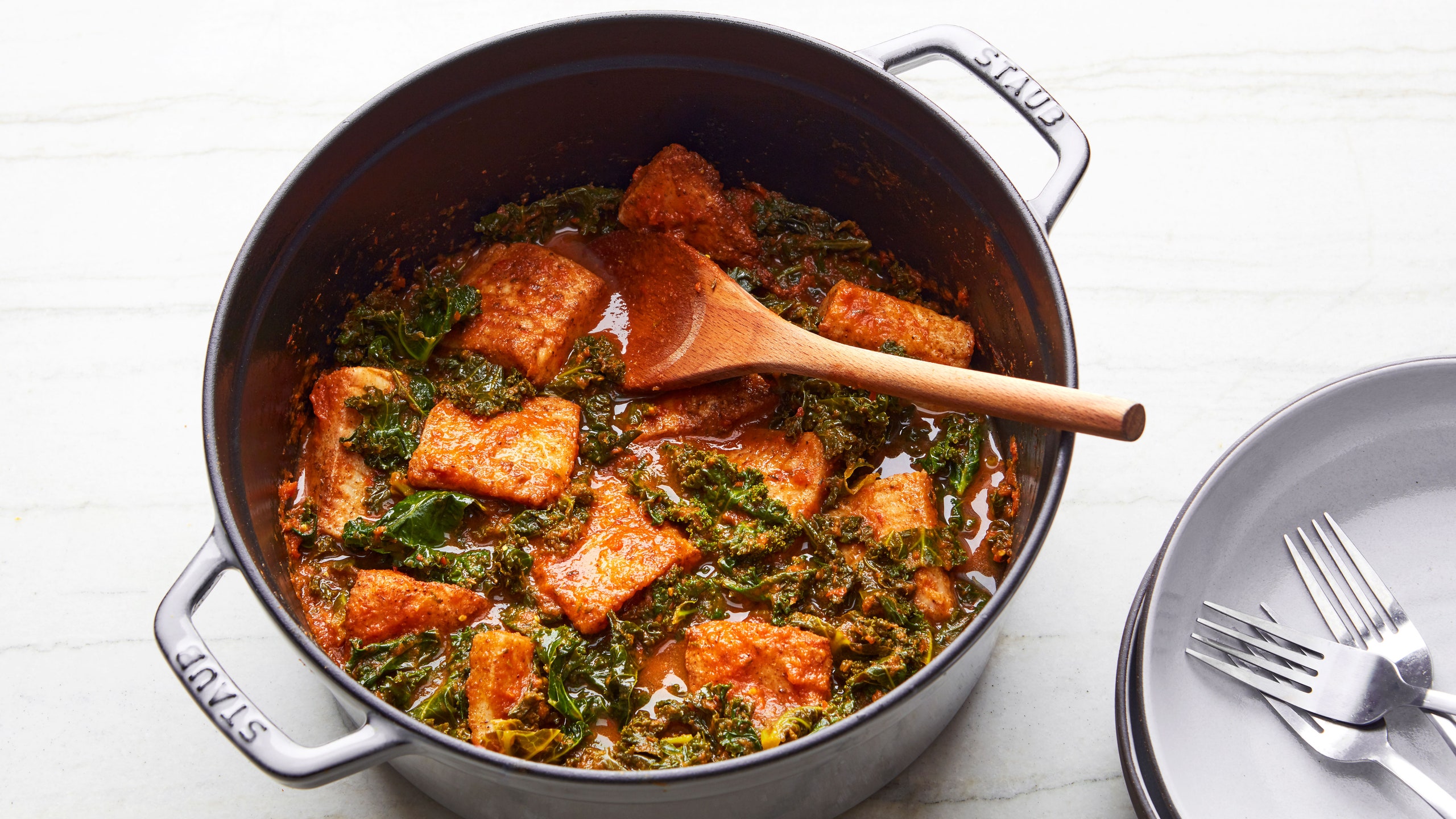 Photo of Efo Riro a Nigerian fish stew in a dutch oven.