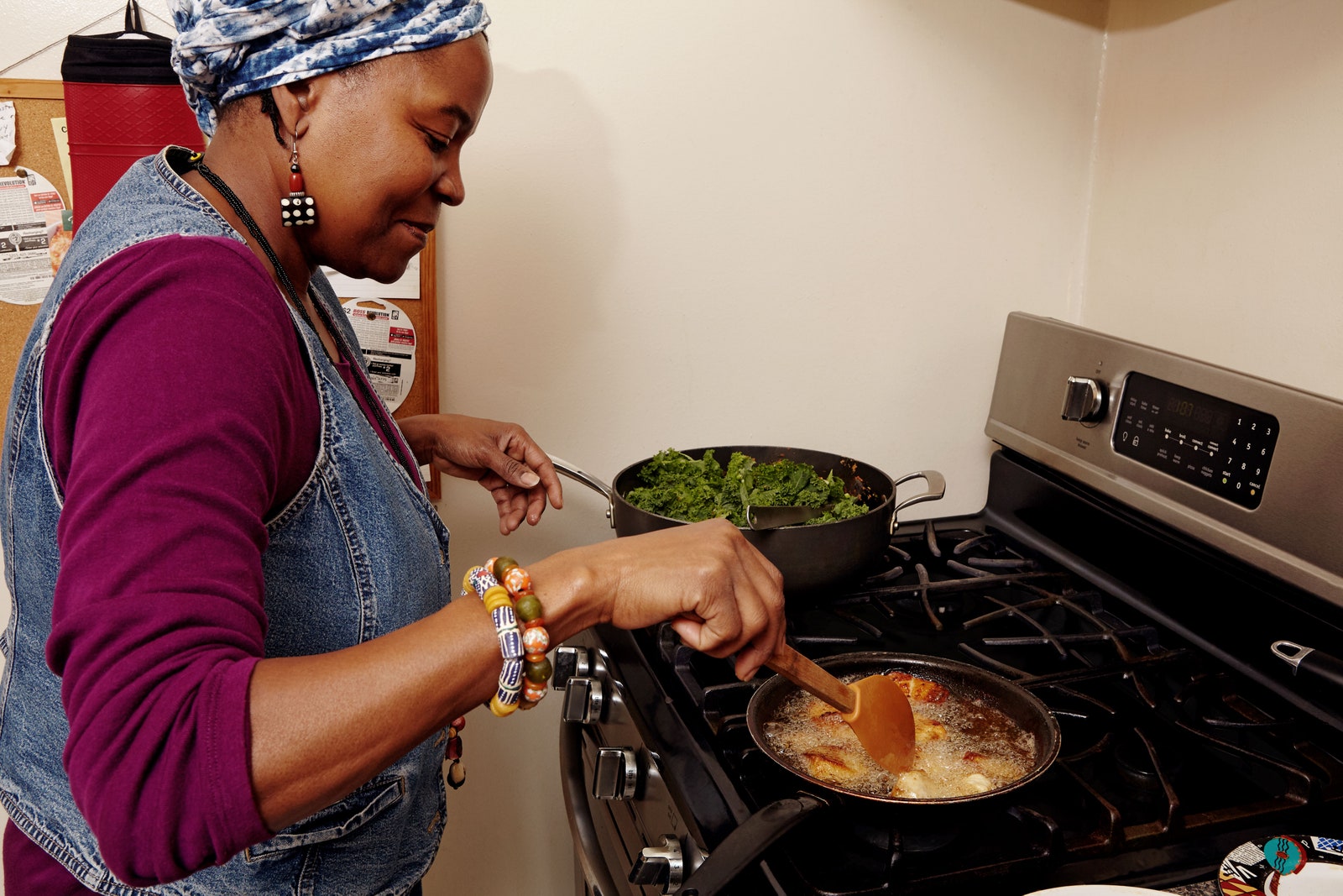 Photo of Kemi Seriki frying tilapia in oil.