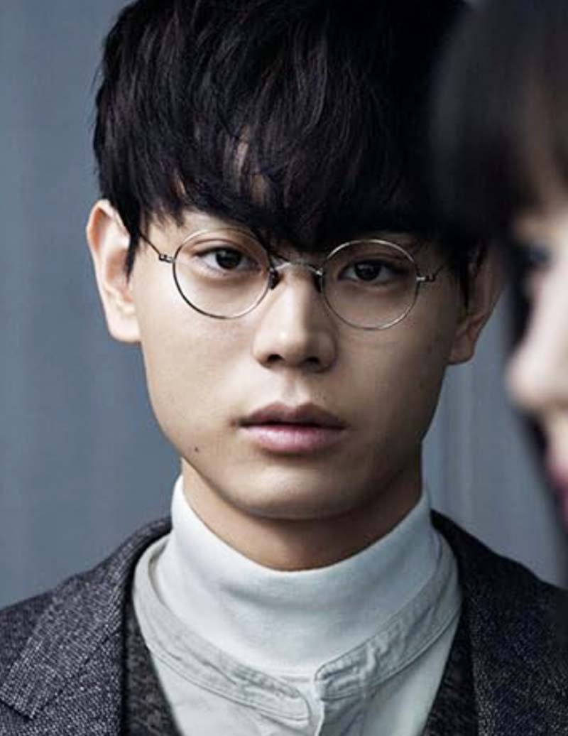 Image may contain Masaki Suda Head Person Face Body Part Neck Accessories Glasses Clothing Coat and Black Hair