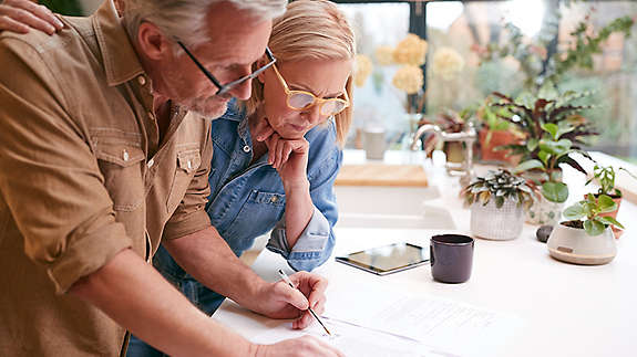 An elder couple going over their finances