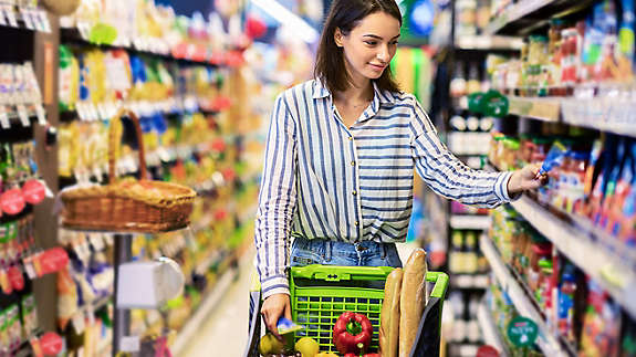 A woman shopping in the grocery store.