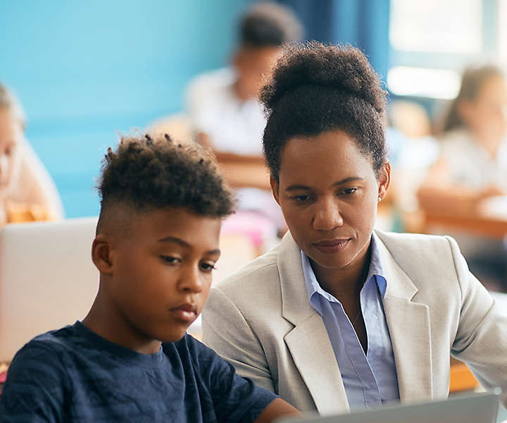 Teacher engaging with young students