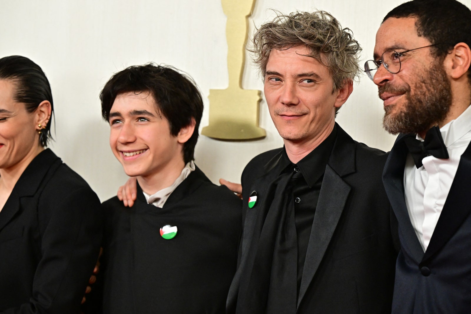 French actor Milo MachadoGraner  and French actor Swann Arlaud  wearing a Palestinian flag pin attend the 96th Annual...