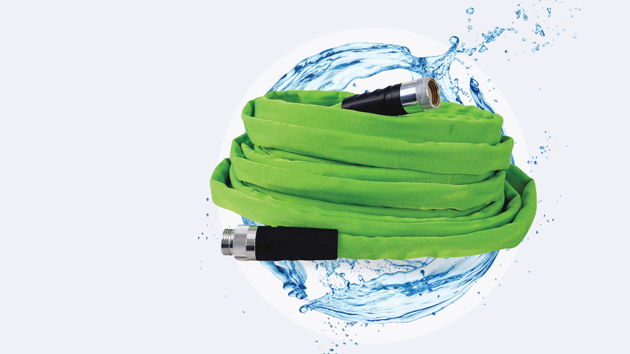 Watersplash and bright green watering hose in a spiral in front of the round water splash