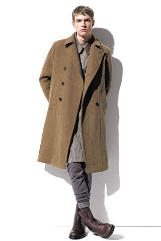 Image may contain Clothing Apparel Overcoat Coat Trench Coat Human and Person