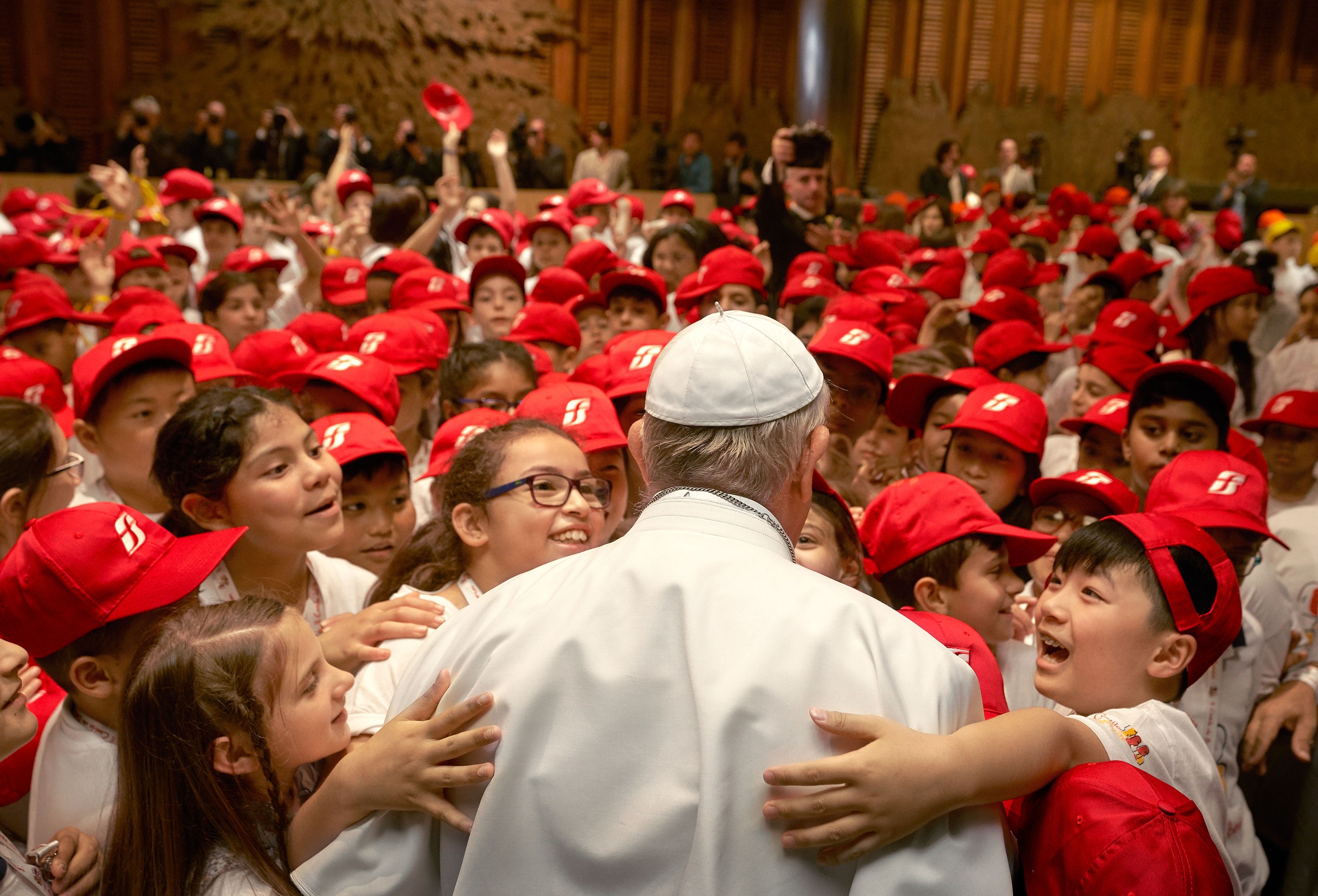 Image may contain Human Person Clothing Apparel Audience Crowd People Cap Hat and Baseball Cap