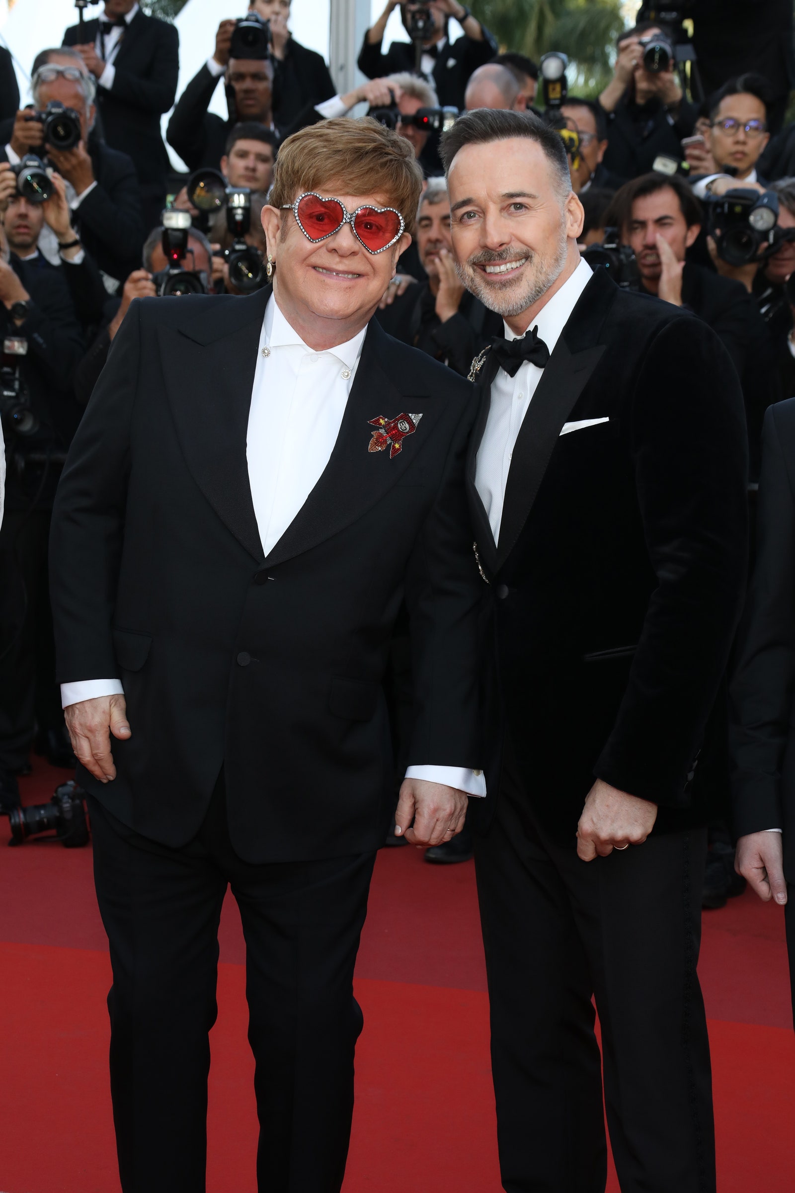 Image may contain David Furnish Fashion Premiere Sunglasses Accessories Accessory Red Carpet and Red Carpet Premiere