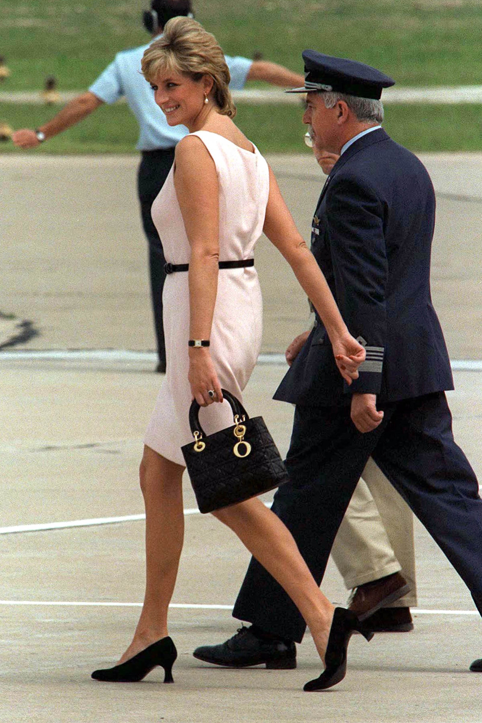 Image may contain Diana Princess of Wales Footwear Clothing Shoe Apparel Human Person High Heel Bag and Handbag
