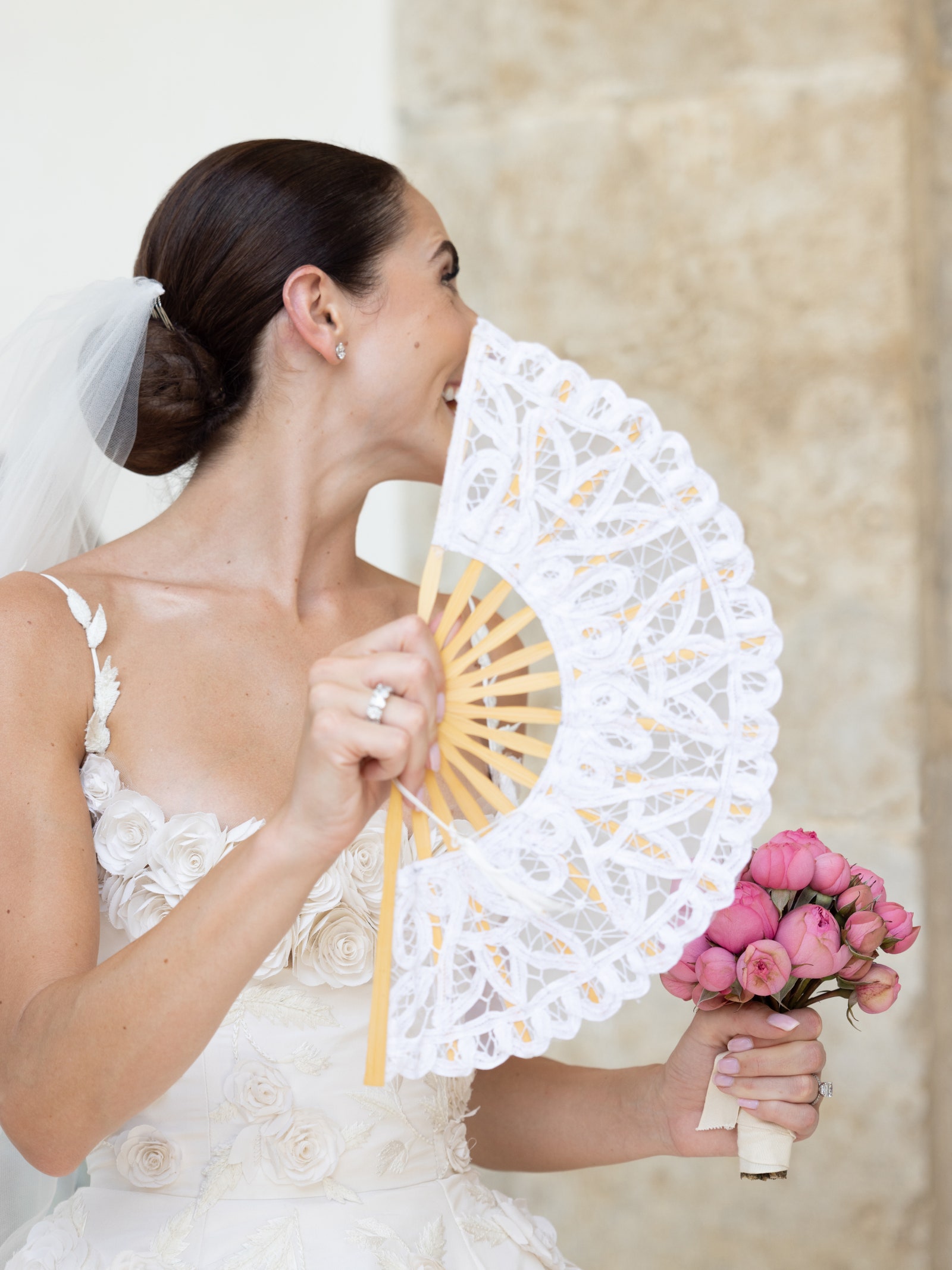 Carly Cucco wanted all of the focus to be on the dress so she styled her hair in a classic low bun and kept her makeup...