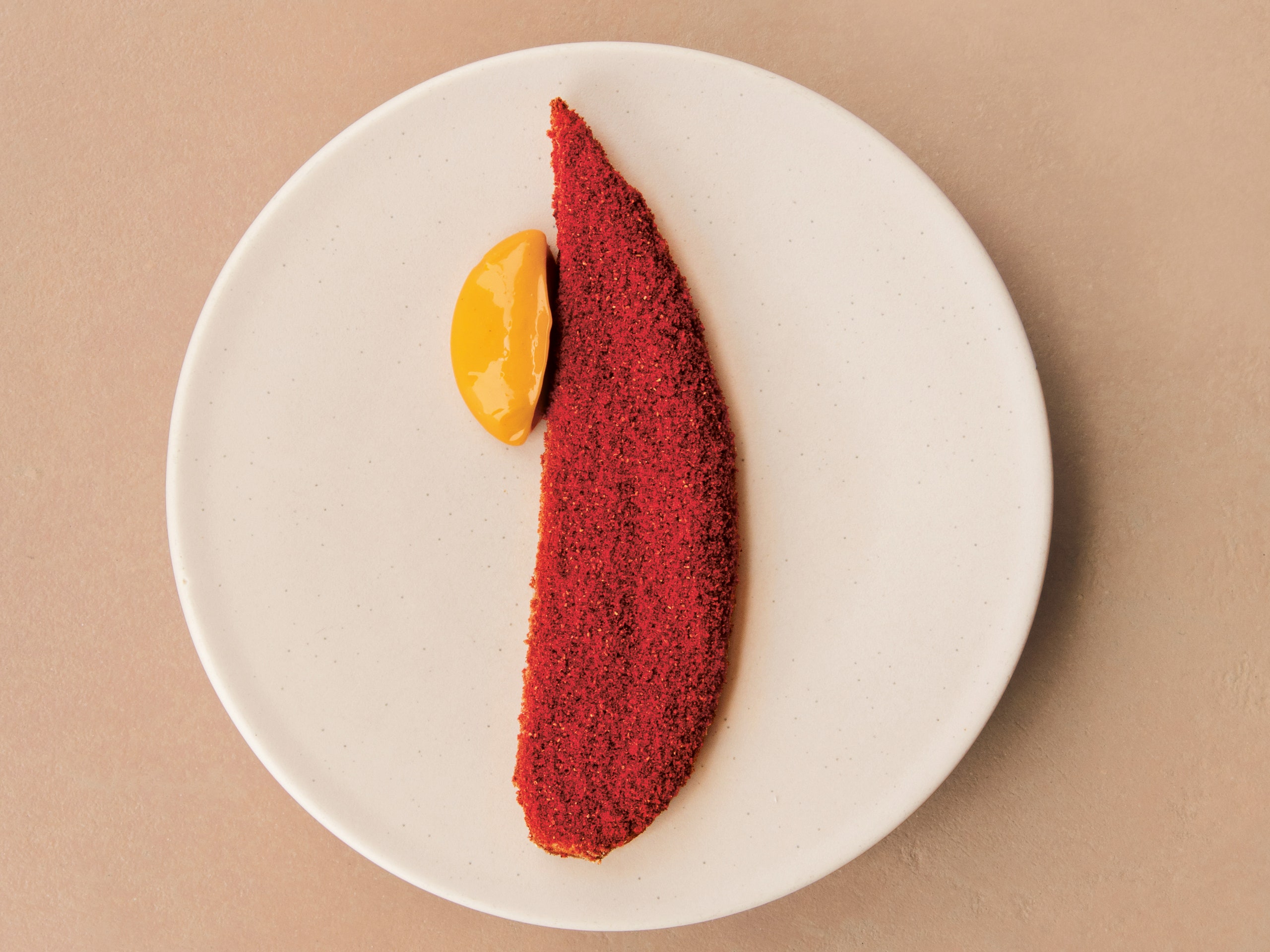 Plantain smoked Scotch bonnet and raspberry from Ikoyi A Journey Through Bold Heat With Recipes by Jeremy Chan.