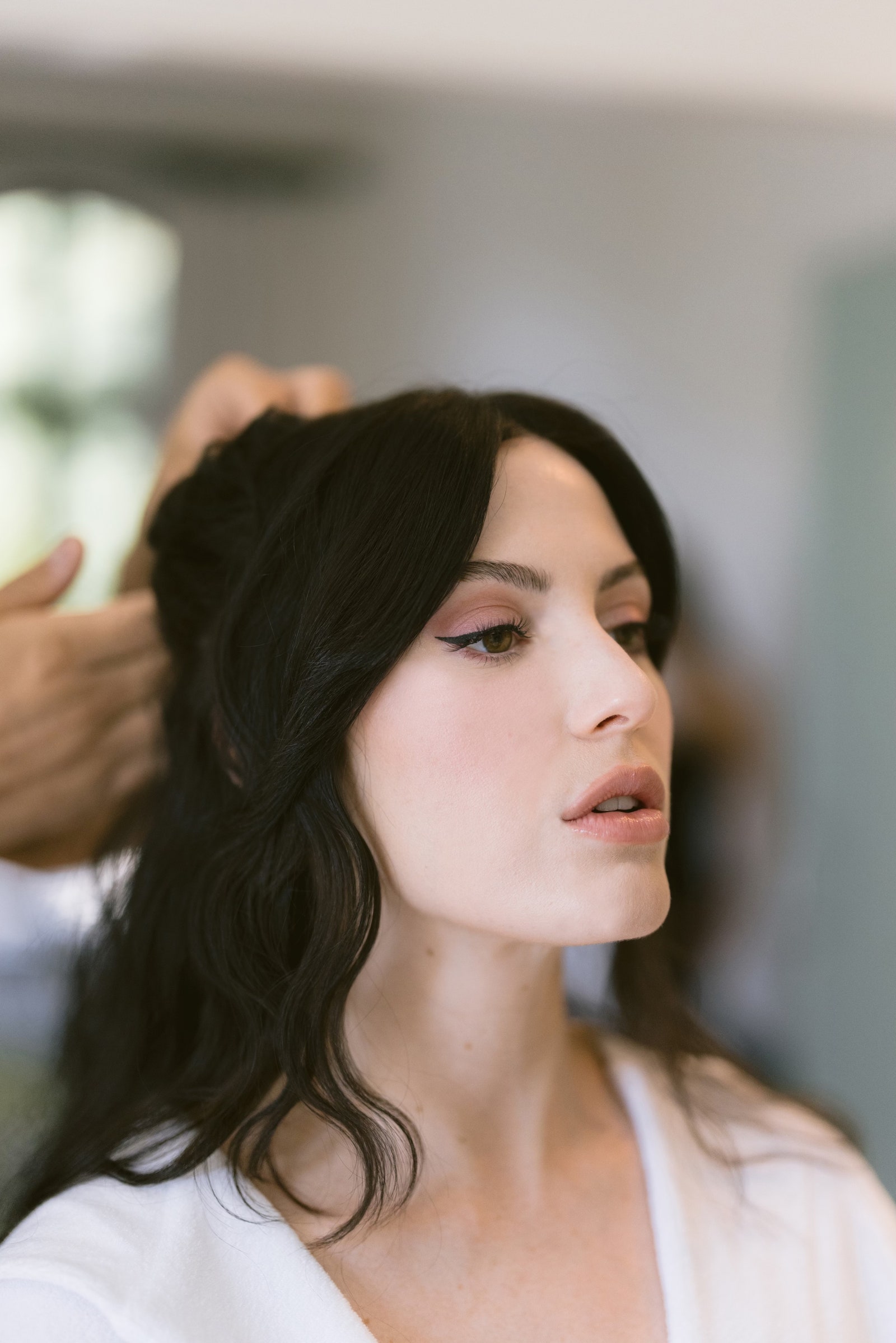 Meredith Rothman went with pinnedback hair and dramatic makeup for her wedding in Los Angeles.