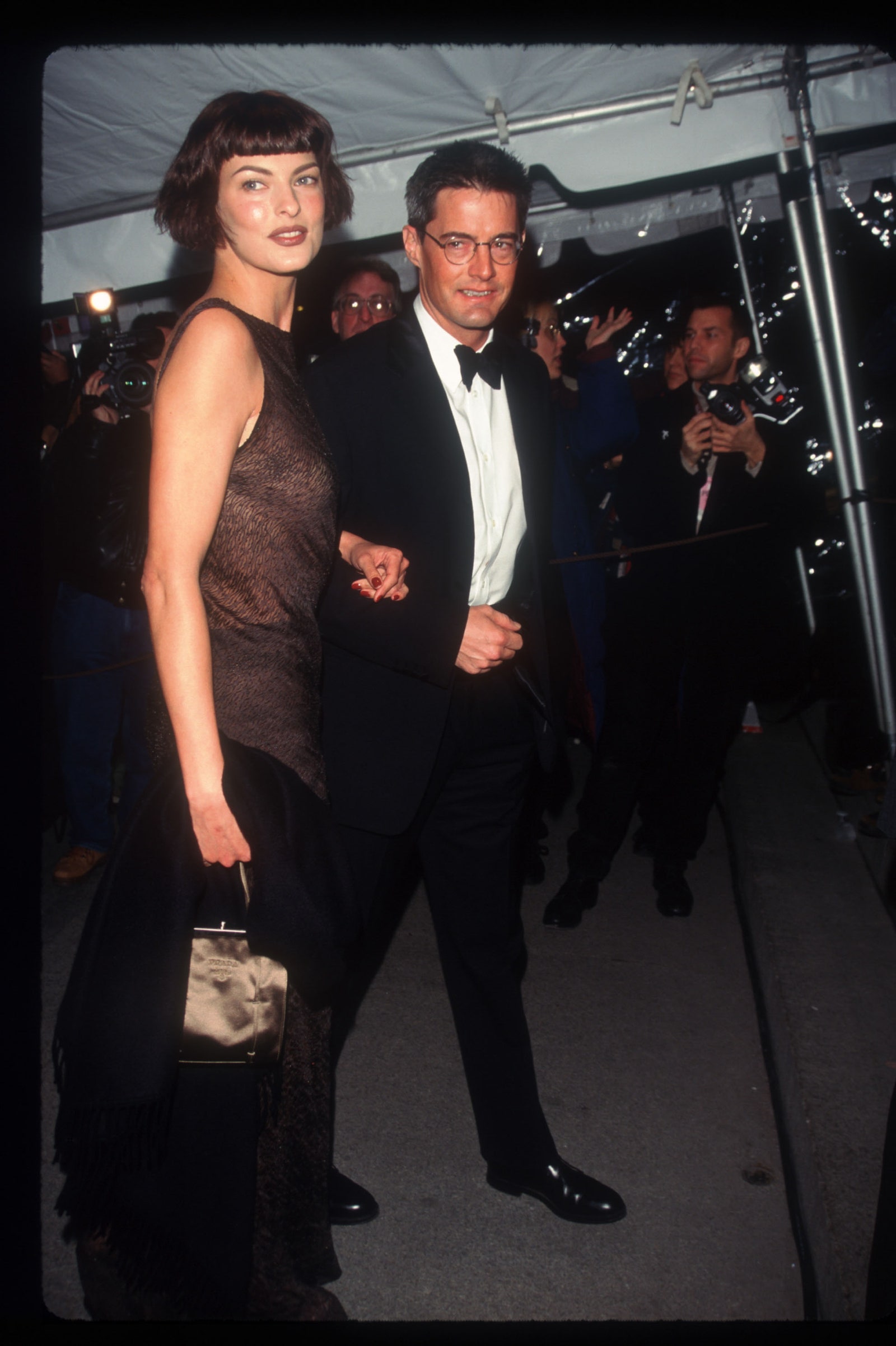 Image may contain Linda Evangelista Kyle MacLachlan Clothing Formal Wear Suit Fashion Blazer Coat and Jacket