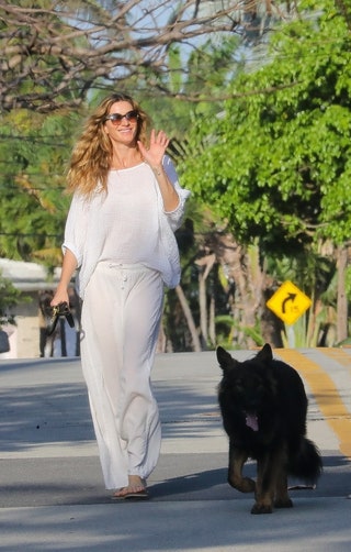 Image may contain Gisele Bündchen Clothing Pants Person Walking Adult Face Head Photography Portrait and Animal