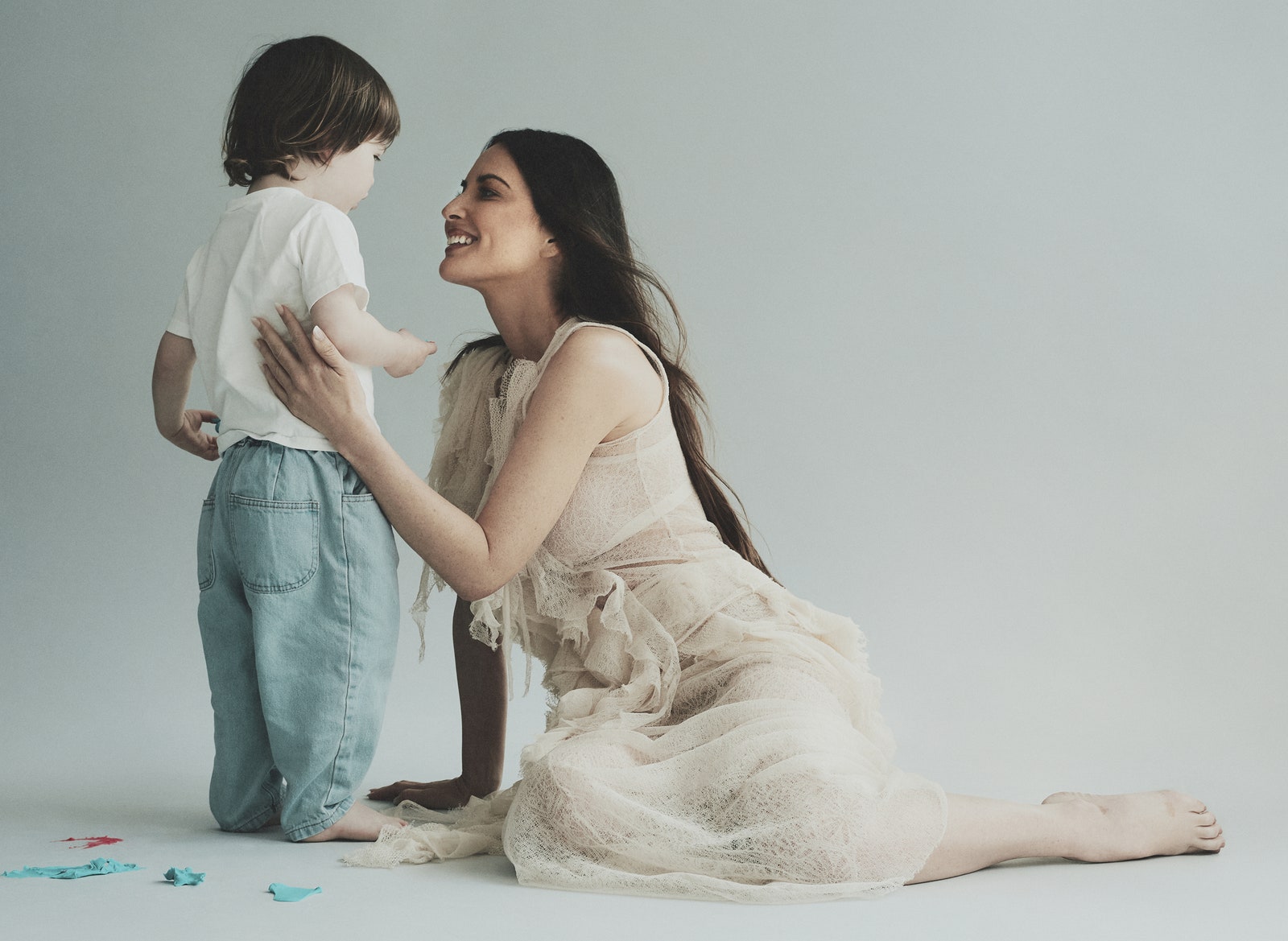 Olivia Munn in a lace dress with her son Malcolm in NYC.