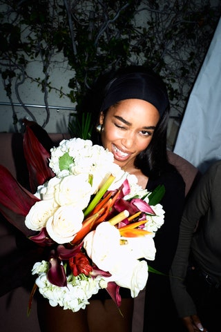 Image may contain Laura Harrier Flower Flower Arrangement Flower Bouquet Plant Rose Face Head and Person