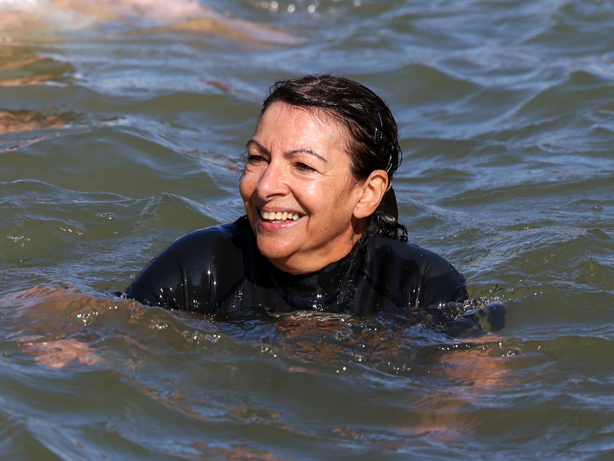 Image may contain Anne Hidalgo Leisure Activities Person Sport Swimming Water Water Sports Bathing Face and Head