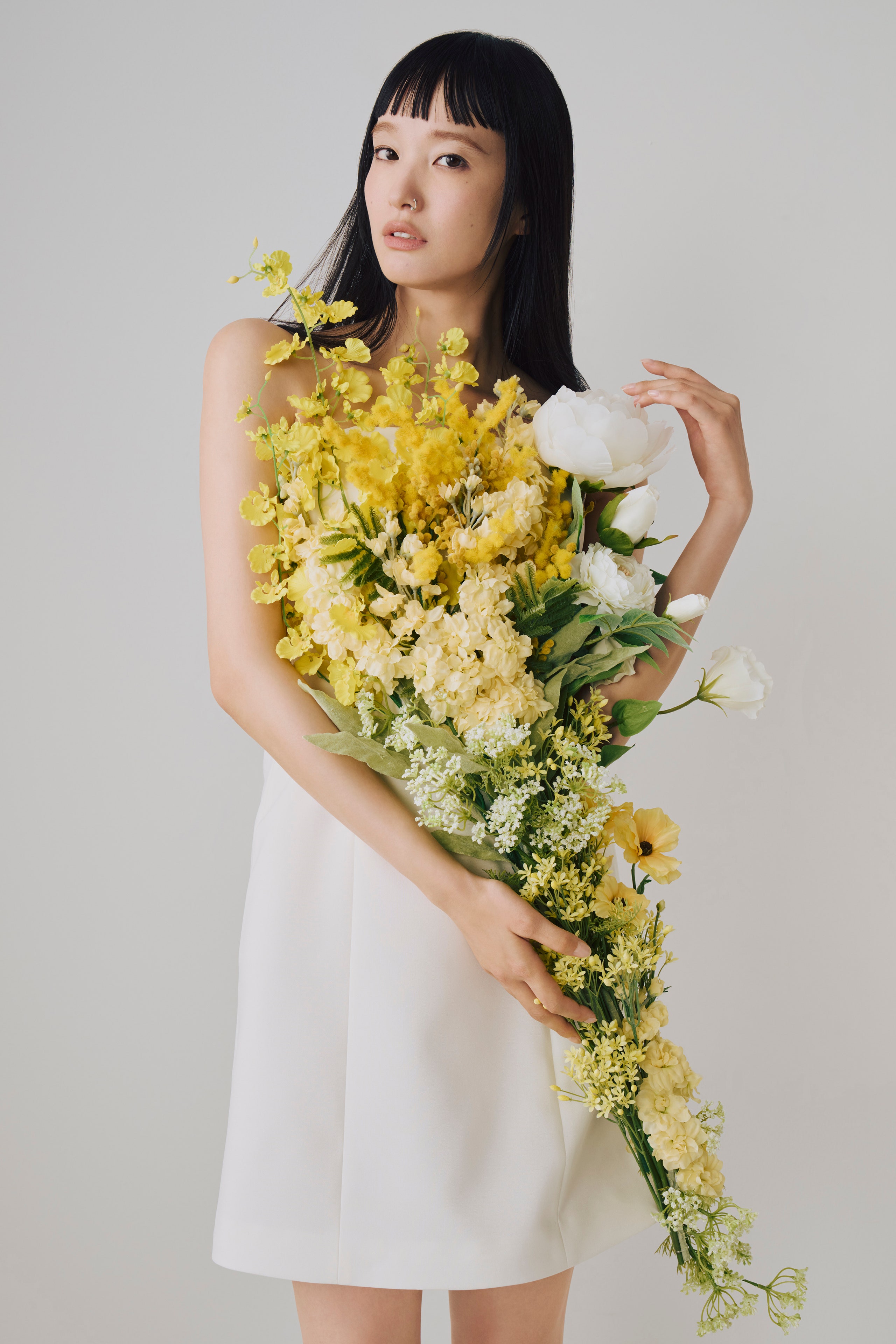 Image may contain Flower Flower Arrangement Plant Flower Bouquet Adult Person Clothing and Dress