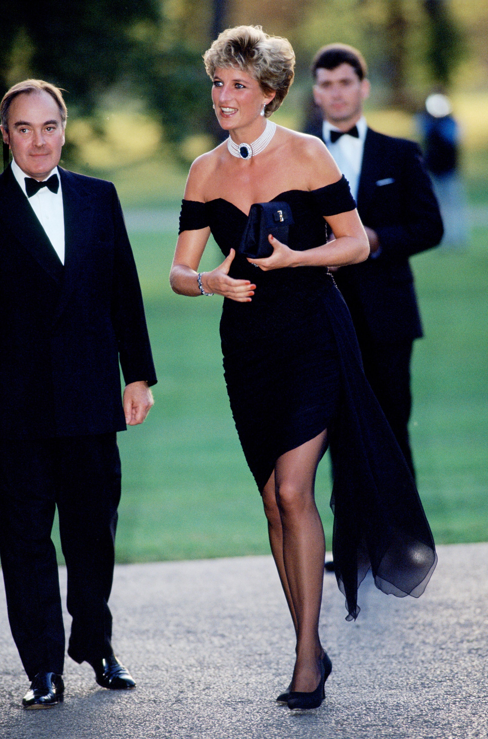 Image may contain Diana Princess of Wales Clothing Apparel Human Person Suit Coat Overcoat and Evening Dress