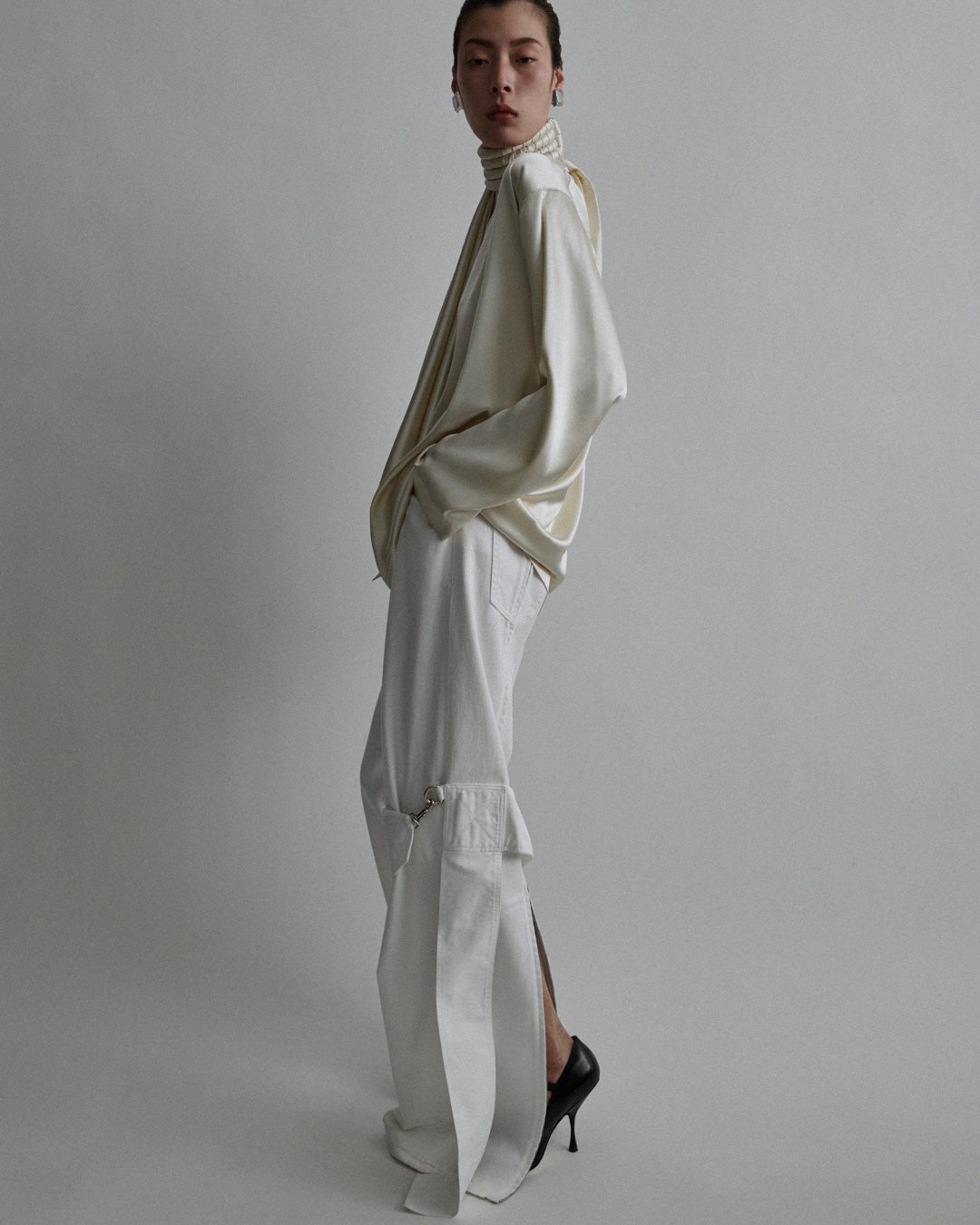 Scarf top in stucco stretch silk satin. Trousers and shoes for spring 2024 delivery.