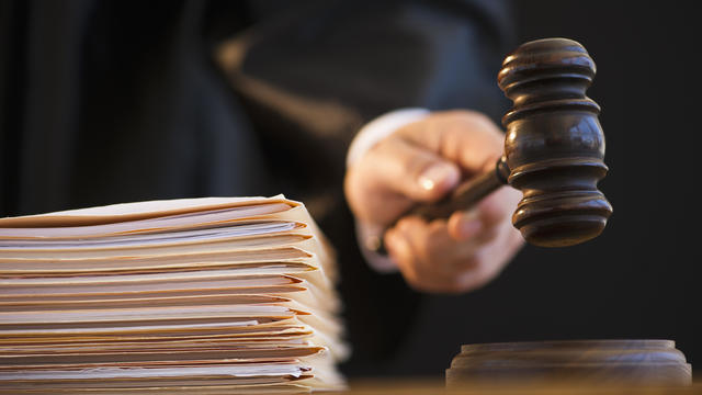 Judge holding gavel, close-up 