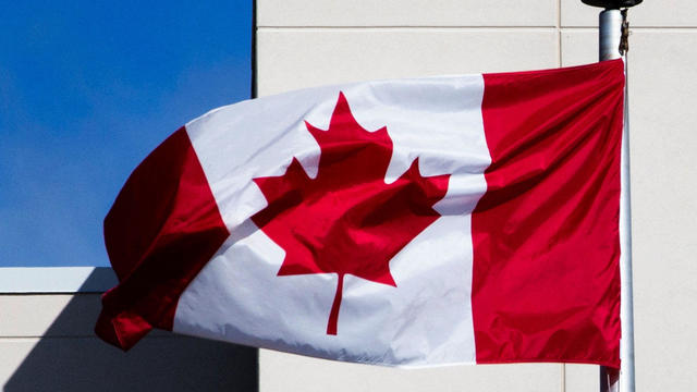 A Canadian flag waves at the BlackBerry campus in Waterloo, Ontario, September 23, 2013. 