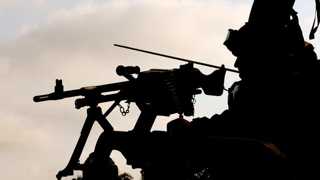 An Israeli soldier sits behind a mounted gun near the southern border with the Gaza Strip on May 1, 2024, amid the ongoing conflict between Israel and the militant group Hamas. 