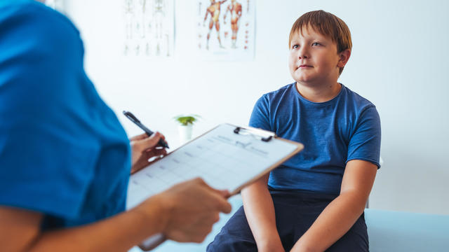 Nurse Adding Patient Test Results 