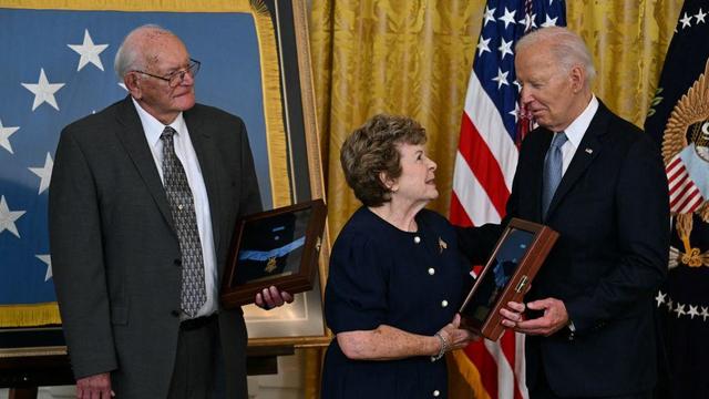 President Biden hands Theresa Chandler, great-great granddaughter of Private George D. Wilson, a posthumous Medal of Honor during a ceremony in the East Room of the White House on July 3, 2024. 