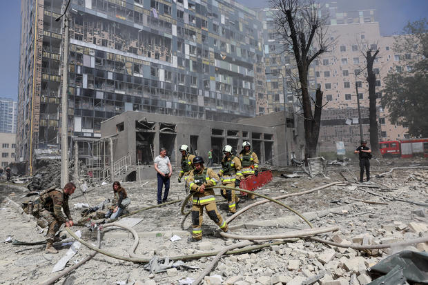 Rescuers work at a site of a building damaged during a Russian missile strikes, in Kyiv 