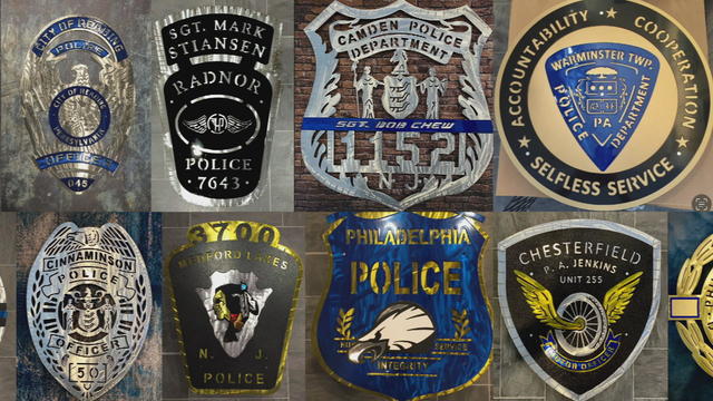 Replica police badges welded by Tom Greico 