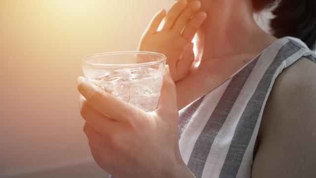 female drinking fresh mineral water at Summer and climate very hot and dry 