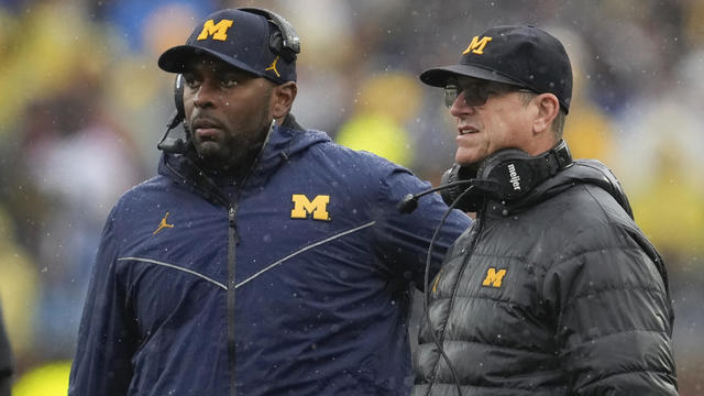 Sherrone Moore and Jim Harbaugh 