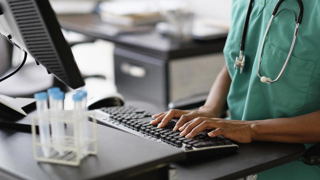 Nurse working at computer 