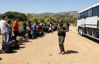 Migrants wait to be processed by the U.S. Border Patrol after crossing the U.S.-Mexico border on June 18, 2024, in Jacumba Hot Springs, California. 